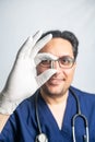 doctor is holding a gloved hand holding a pill. Medicines for medicine, healthcare, treatment of diseases. Close-up. Selective