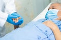 Doctor holding hand Asian senior or elderly old lady woman patient wearing a face mask in hospital