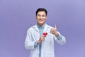 Doctor holding heart shape toy and thumb up Royalty Free Stock Photo