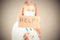 A doctor holding a help sign isolated Royalty Free Stock Photo