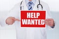 Doctor Holding Help Wanted Banner Royalty Free Stock Photo