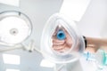Doctor holding inhalation anesthesia mask