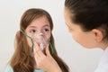 Doctor Holding Inhaler Mask For Girl Breathing Royalty Free Stock Photo