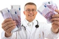 Doctor holding a lot of money euros Royalty Free Stock Photo