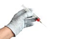 Doctor holding medical injection syringe wearing surgical rubber gloves. Royalty Free Stock Photo