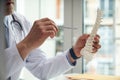 Doctor holding a model of a human spine Royalty Free Stock Photo