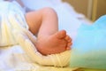 Doctor holding newborn child`s foot in hospital Royalty Free Stock Photo