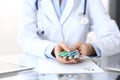 Doctor holding pack of different tablet blisters closeup. Life save service, legal drug store, prescribe medication Royalty Free Stock Photo