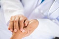 Doctor holding patient`s hand. Medicine and health care concept. Royalty Free Stock Photo