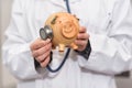 Doctor holding piggy bank close up. Medical insurance and health care money concept