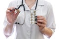 Doctor holding pill and blister isolated on white Royalty Free Stock Photo