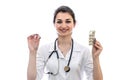 Doctor holding pill and blister isolated on white Royalty Free Stock Photo