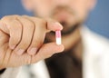 Doctor holding a pill, solution for you, Royalty Free Stock Photo