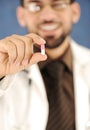 Doctor holding a pill, solution for you, Royalty Free Stock Photo