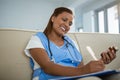 Doctor holding pills bottle and writing prescription Royalty Free Stock Photo