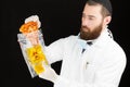 Doctor holding pizza in plastic bag. Royalty Free Stock Photo