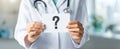 The doctor holding a question mark card in a medical setting. AI generated image Royalty Free Stock Photo