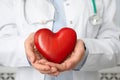 Doctor holding red heart, closeup. Royalty Free Stock Photo