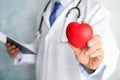 Doctor holding red heart, closeup view with space for text Royalty Free Stock Photo