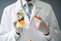 Doctor Holding Saline Bag With Fruit Slices Inside In Hospital