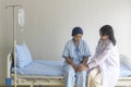 Doctor holding senior cancer patient`s hand in hospital, health care and medical concept Royalty Free Stock Photo
