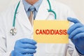 Doctor holding sign with text Candidiasis closeup