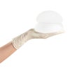 Doctor holding silicone implants for breast augmentation on white background. Royalty Free Stock Photo