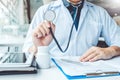 Doctor holding a stethoscope blood pressure man patient Health care in hospital