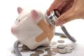 Doctor Holding Stethoscope to Piggy Bank Royalty Free Stock Photo