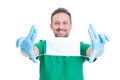 Doctor holding surgical mask with text area