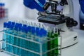 Doctor holding test tube with blue liquid, laboratory analysis for microscopic Royalty Free Stock Photo