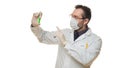 Doctor holding test tube with virus blood sample and keeps finger in warning sign. Healthcare and medical concept Royalty Free Stock Photo