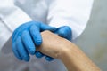 Doctor holding touching hands Asian senior or elderly old lady woman patient with love, care, helping, encourage and empathy Royalty Free Stock Photo