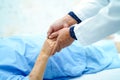 Doctor holding touching hands Asian senior or elderly old lady woman patient with love, care, helping, encourage and empathy.