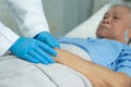 Doctor holding touching hands Asian senior or elderly old lady woman patient with love, care, helping, encourage and empathy Royalty Free Stock Photo