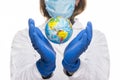 Doctor holding a world globe In her Hands. Concept Of World Health Royalty Free Stock Photo