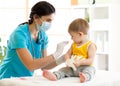 Doctor holds an injection vaccination the child Royalty Free Stock Photo