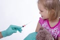 Doctor holds an injection vaccination little girl Royalty Free Stock Photo