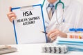 Doctor holds paper with inscription Health Savings Account HSA