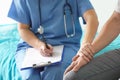 Doctor holds the patient`s hand Royalty Free Stock Photo