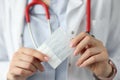 Doctor holds probiotics and prebiotics in his hand