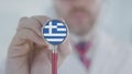 Physician uses stethoscope with the Greek flag. Healthcare in Greece