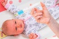 Doctor holds syringe to vaccinate newborn baby Royalty Free Stock Photo