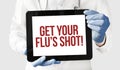 Doctor in holds a tablet with text get your flus shot