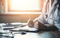 Doctor in hospital on duty in white coat reading patient's information with pen in hand, filling prescription or checklist