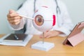 Doctor with human Eye anatomy model with magnifying glass. Eye disease, Refractive Errors, Age Related Macular Degeneration,