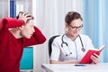 Doctor ignoring patient Royalty Free Stock Photo