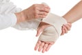 Doctor imposes an elastic bandage to the patient's hand
