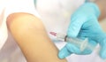 Doctor injecting drug dose into his arm by using syringe.  Drug addict injecting drugs concept Royalty Free Stock Photo