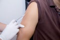 Doctor Injecting Patient With Syringe To Collect Blood. Royalty Free Stock Photo